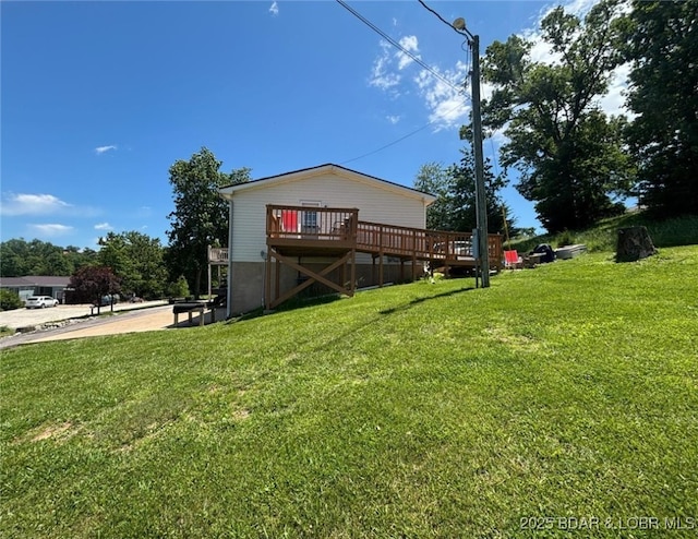 17362 Country Life Rd, Gravois Mills, MO 65037 - rear view of house featuring a deck and a lawn