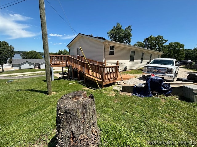 17362 Country Life Rd, Gravois Mills, MO 65037 - back of house featuring a deck and a yard