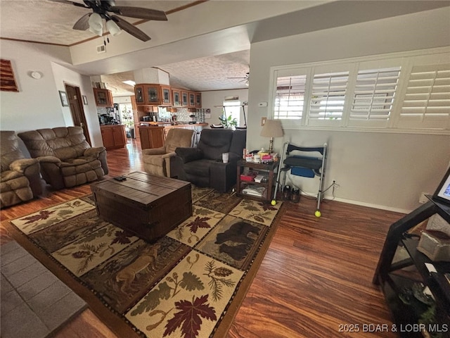 17362 Country Life Rd, Gravois Mills, MO 65037 - living room with dark wood-style flooring, ceiling fan, lofted ceiling, and a textured ceiling