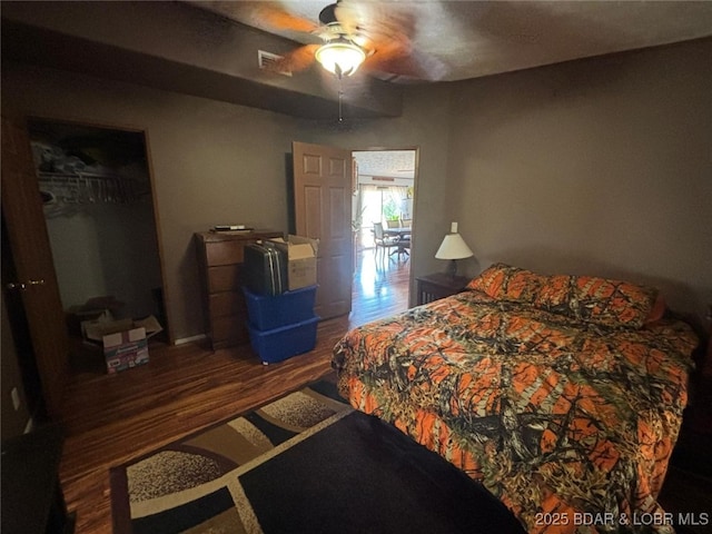 17362 Country Life Rd, Gravois Mills, MO 65037 - bedroom with wood finished floors, a closet, and ceiling fan