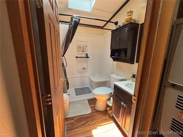 17362 Country Life Rd, Gravois Mills, MO 65037 - bathroom with a stall shower, a skylight, wood finished floors, and vanity