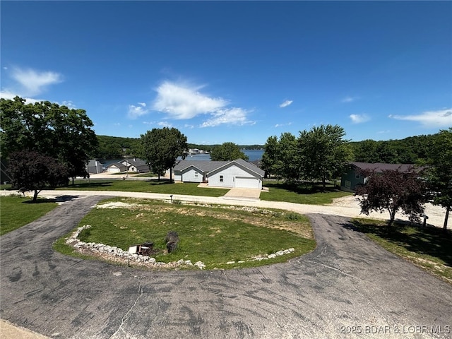 17362 Country Life Rd, Gravois Mills, MO 65037 - surrounding community with curved driveway and a yard