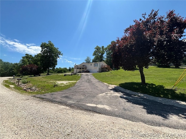 17362 Country Life Rd, Gravois Mills, MO 65037 - view of front of property with a front lawn and driveway