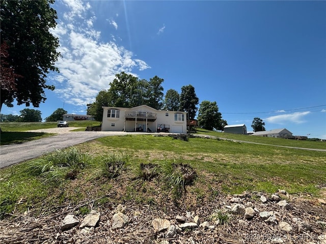 17362 Country Life Rd, Gravois Mills, MO 65037 - view of front of home with a front yard, driveway, and a deck
