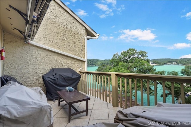 2500 Bay Point Ln Unit 444, Osage Beach, MO 65065 - balcony with a grill and a water view