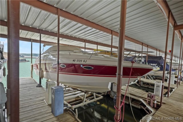 2500 Bay Point Ln Unit 444, Osage Beach, MO 65065 - dock area featuring boat lift and a water view