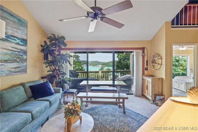 2500 Bay Point Ln Unit 444, Osage Beach, MO 65065 - living area with ceiling fan, vaulted ceiling, healthy amount of natural light, and carpet floors