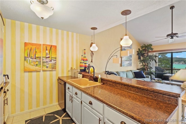 2500 Bay Point Ln Unit 444, Osage Beach, MO 65065 - kitchen featuring dark tile patterned floors, dark countertops, dishwasher, open floor plan, and wallpapered walls