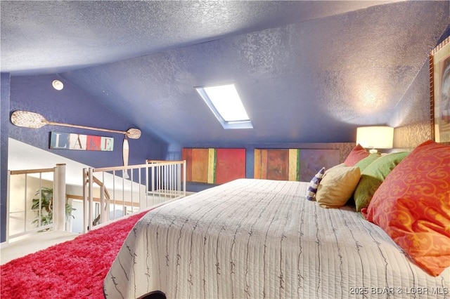 2500 Bay Point Ln Unit 444, Osage Beach, MO 65065 - bedroom featuring lofted ceiling, a textured ceiling, a skylight, and carpet flooring