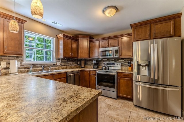 326 Bloomington Dr, Four Seasons, MO 65049 - kitchen with stainless steel appliances, tasteful backsplash, light tile patterned flooring, and hanging light fixtures