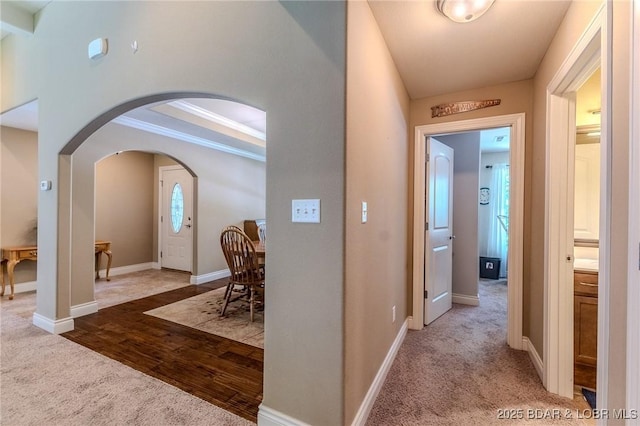 326 Bloomington Dr, Four Seasons, MO 65049 - corridor with arched walkways, carpet, wood finished floors, and ornamental molding