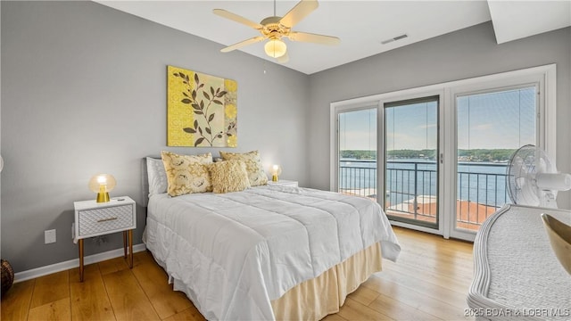 54 Palisades Lakeview Dr Unit 1B, Lake Ozark, MO 65049 - bedroom featuring access to exterior, light wood-style flooring, and a ceiling fan
