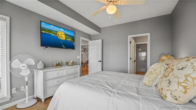 54 Palisades Lakeview Dr Unit 1B, Lake Ozark, MO 65049 - bedroom with a ceiling fan and ensuite bathroom
