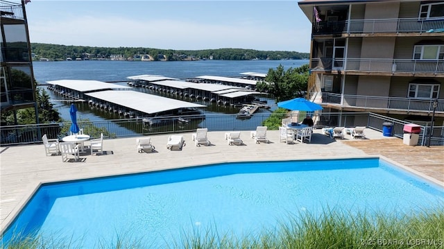 54 Palisades Lakeview Dr Unit 1B, Lake Ozark, MO 65049 - view of pool featuring a water view and a patio area