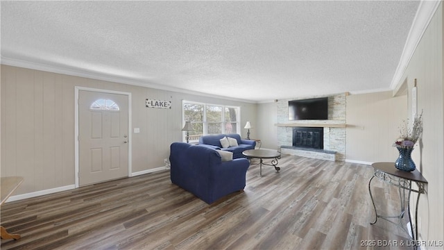160 Bridgeview Dr, Camdenton, MO 65020 - living area featuring ornamental molding, wood finished floors, a textured ceiling, and a fireplace