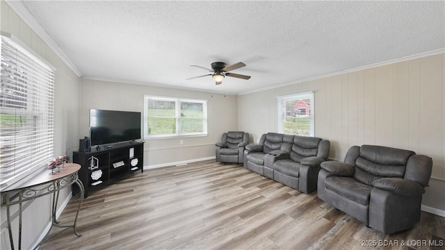 160 Bridgeview Dr, Camdenton, MO 65020 - living area with crown molding, healthy amount of natural light, ceiling fan, light wood-style flooring, and a textured ceiling