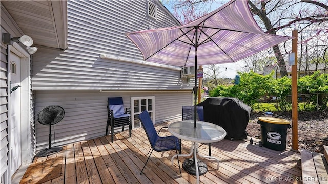 160 Bridgeview Dr, Camdenton, MO 65020 - wooden deck featuring a grill and outdoor dining area