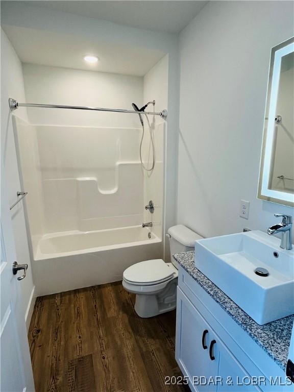295 Highland Shores Dr Unit 5F, Lake Ozark, MO 65049 - bathroom with wood finished floors, vanity, and tub / shower combination