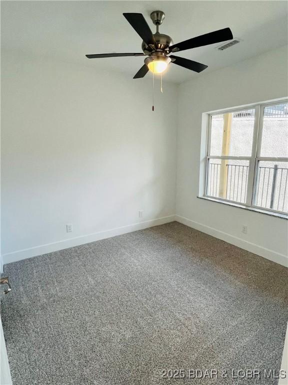 295 Highland Shores Dr Unit 5F, Lake Ozark, MO 65049 - unfurnished room with carpet floors and ceiling fan