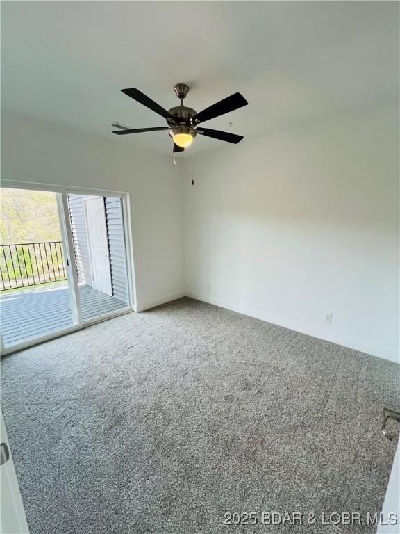 295 Highland Shores Dr Unit 5F, Lake Ozark, MO 65049 - unfurnished room featuring carpet and a ceiling fan