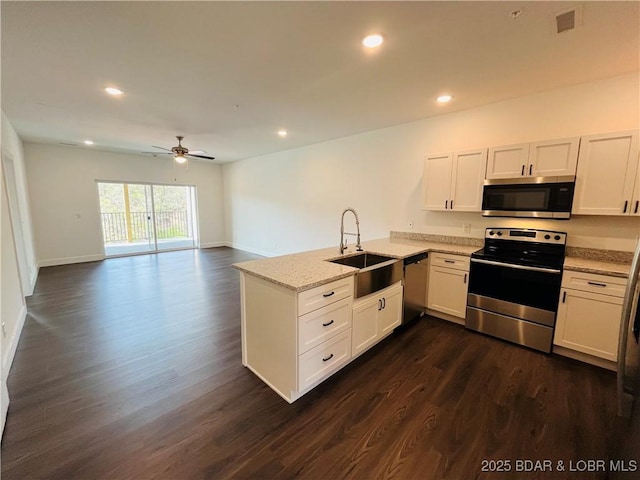 295 Highland Shores Dr Unit 4D, Lake Ozark, MO 65049 - kitchen featuring stainless steel appliances, a peninsula, a ceiling fan, dark wood-style floors, and recessed lighting