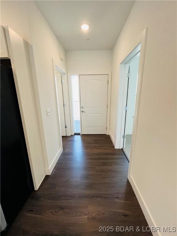 295 Highland Shores Dr Unit 4D, Lake Ozark, MO 65049 - hallway featuring dark wood-type flooring