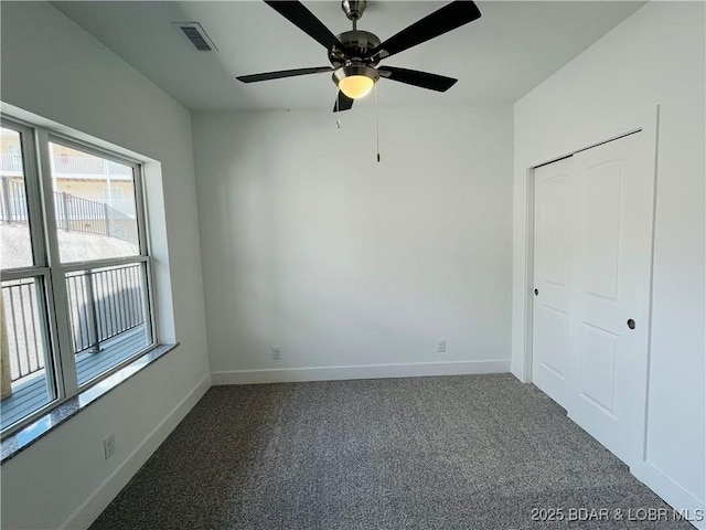295 Highland Shores Dr Unit 4D, Lake Ozark, MO 65049 - unfurnished bedroom featuring carpet flooring and ceiling fan