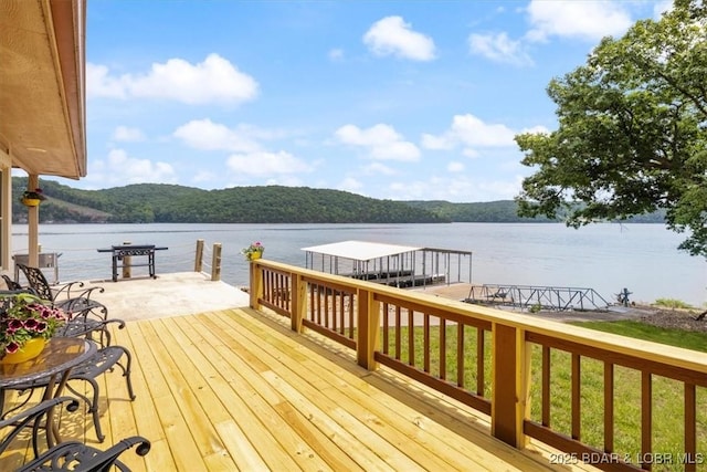 97 Random Rd, Edwards, MO 65326 - wooden terrace featuring a water view and a dock