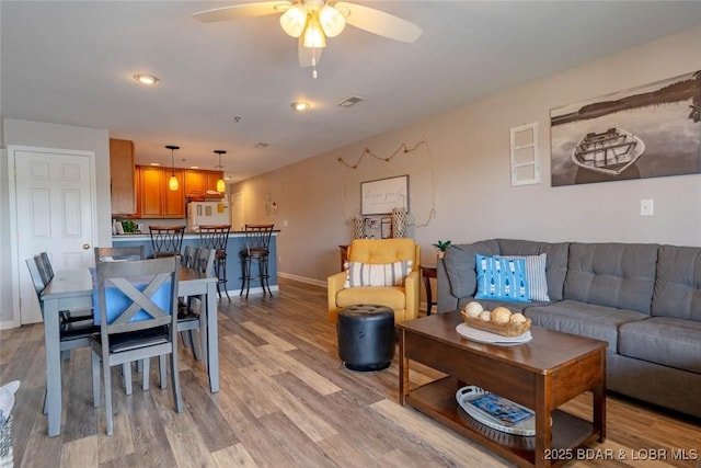 1481 Ledges Dr Unit C24, Osage Beach, MO 65065 - living room with light wood finished floors and ceiling fan