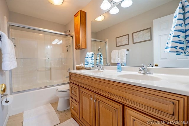 1481 Ledges Dr Unit C24, Osage Beach, MO 65065 - full bathroom with double vanity, tile patterned flooring, and combined bath / shower with glass door