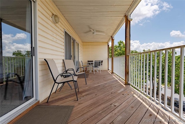 1481 Ledges Dr Unit C24, Osage Beach, MO 65065 - wooden terrace with a ceiling fan and outdoor dining space