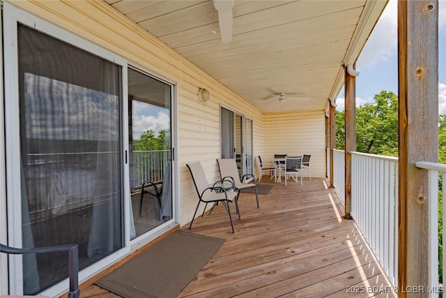 1481 Ledges Dr Unit C24, Osage Beach, MO 65065 - deck with ceiling fan and outdoor dining space
