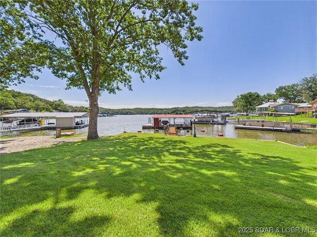 1620 Triple Cove Ln, Climax Springs, MO 65324 - view of grassy yard with a water view and a dock