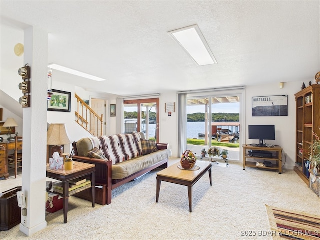 1620 Triple Cove Ln, Climax Springs, MO 65324 - living room with stairs, carpet flooring, and a textured ceiling