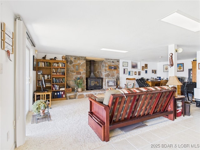 1620 Triple Cove Ln, Climax Springs, MO 65324 - living room with a wood stove and tile patterned floors