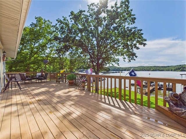 1620 Triple Cove Ln, Climax Springs, MO 65324 - wooden terrace featuring a water view and outdoor dining space