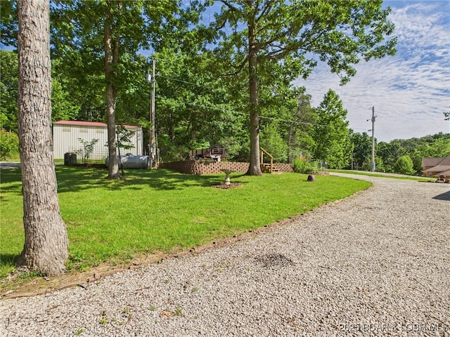 1620 Triple Cove Ln, Climax Springs, MO 65324 - view of grassy yard featuring driveway