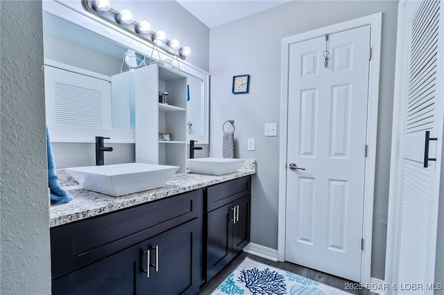 35 Casa Blanca Ct Unit 220-1A, Lake Ozark, MO 65049 - full bathroom with double vanity and wood finished floors