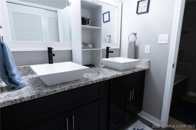 35 Casa Blanca Ct Unit 220-1A, Lake Ozark, MO 65049 - full bath with double vanity and baseboards