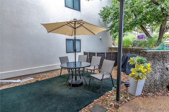 35 Casa Blanca Ct Unit 220-1A, Lake Ozark, MO 65049 - view of patio featuring outdoor dining space