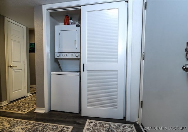 35 Casa Blanca Ct Unit 220-1A, Lake Ozark, MO 65049 - washroom with stacked washer / dryer and dark wood finished floors