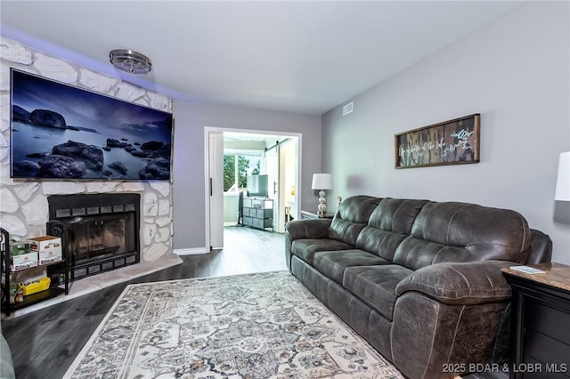 35 Casa Blanca Ct Unit 220-1A, Lake Ozark, MO 65049 - living area featuring wood finished floors and a premium fireplace