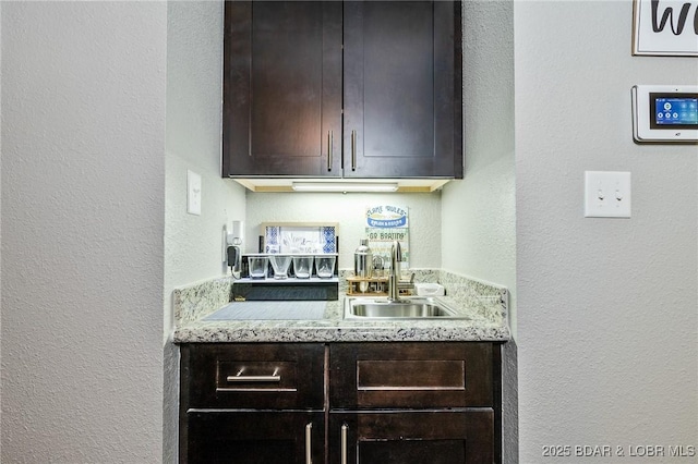 35 Casa Blanca Ct Unit 220-1A, Lake Ozark, MO 65049 - indoor wet bar featuring a textured wall