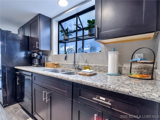 35 Casa Blanca Ct Unit 220-1A, Lake Ozark, MO 65049 - kitchen featuring light wood-style floors, freestanding refrigerator, light stone countertops, and stainless steel dishwasher