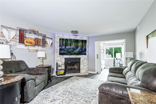 35 Casa Blanca Ct Unit 220-1A, Lake Ozark, MO 65049 - living area with a fireplace and wood finished floors
