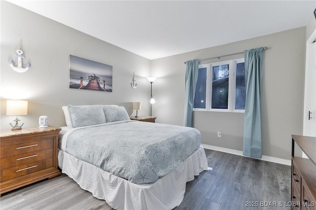 35 Casa Blanca Ct Unit 220-1A, Lake Ozark, MO 65049 - bedroom with dark wood-style floors and baseboards