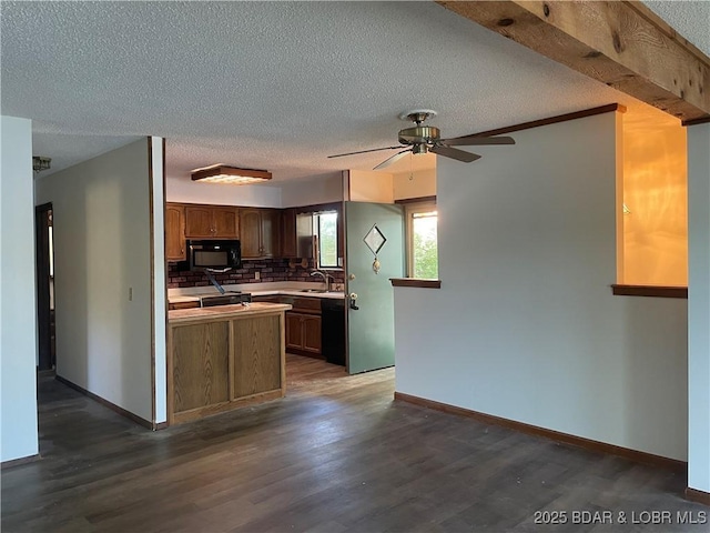 192 Ke Jo Point Rd, Gravois Mills, MO 65037 - kitchen featuring black appliances, a ceiling fan, dark wood-type flooring, a textured ceiling, and backsplash