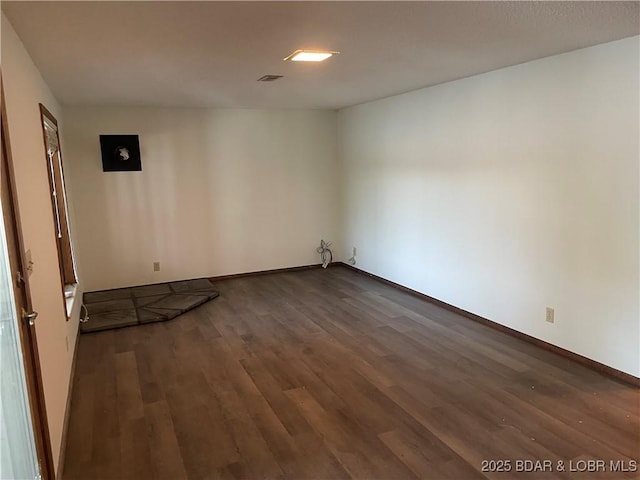 192 Ke Jo Point Rd, Gravois Mills, MO 65037 - unfurnished room with dark wood-type flooring and baseboards
