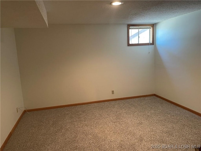 192 Ke Jo Point Rd, Gravois Mills, MO 65037 - below grade area featuring carpet floors, a textured ceiling, and recessed lighting
