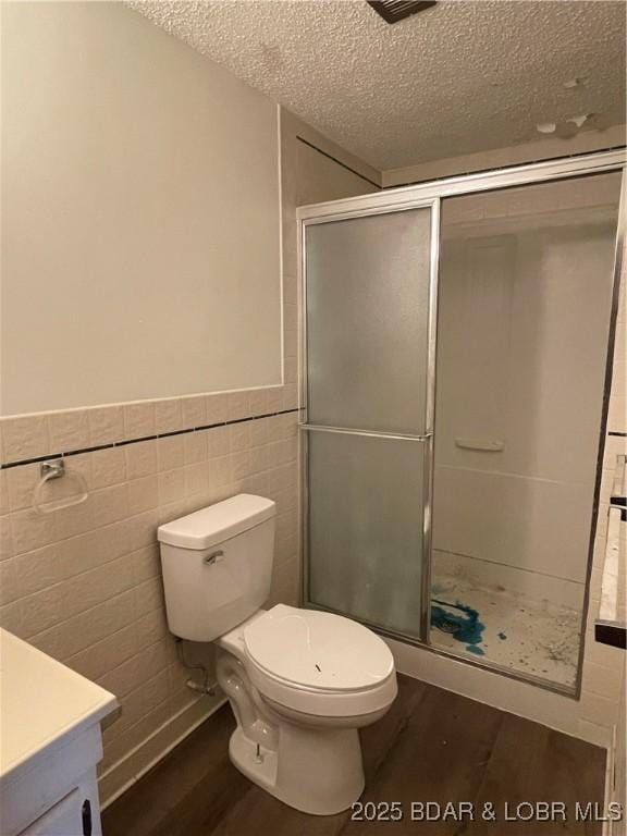 192 Ke Jo Point Rd, Gravois Mills, MO 65037 - full bath featuring wood finished floors, a textured ceiling, a stall shower, vanity, and wainscoting
